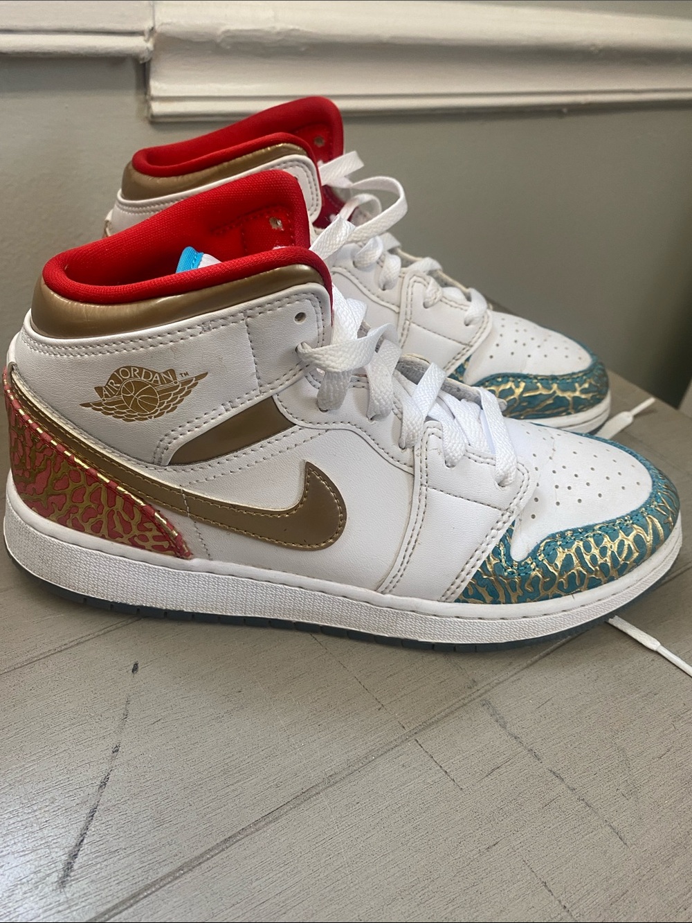 Jordan Kids White High-Top Sneakers with Gold, Red, Teal and Pink Accents
